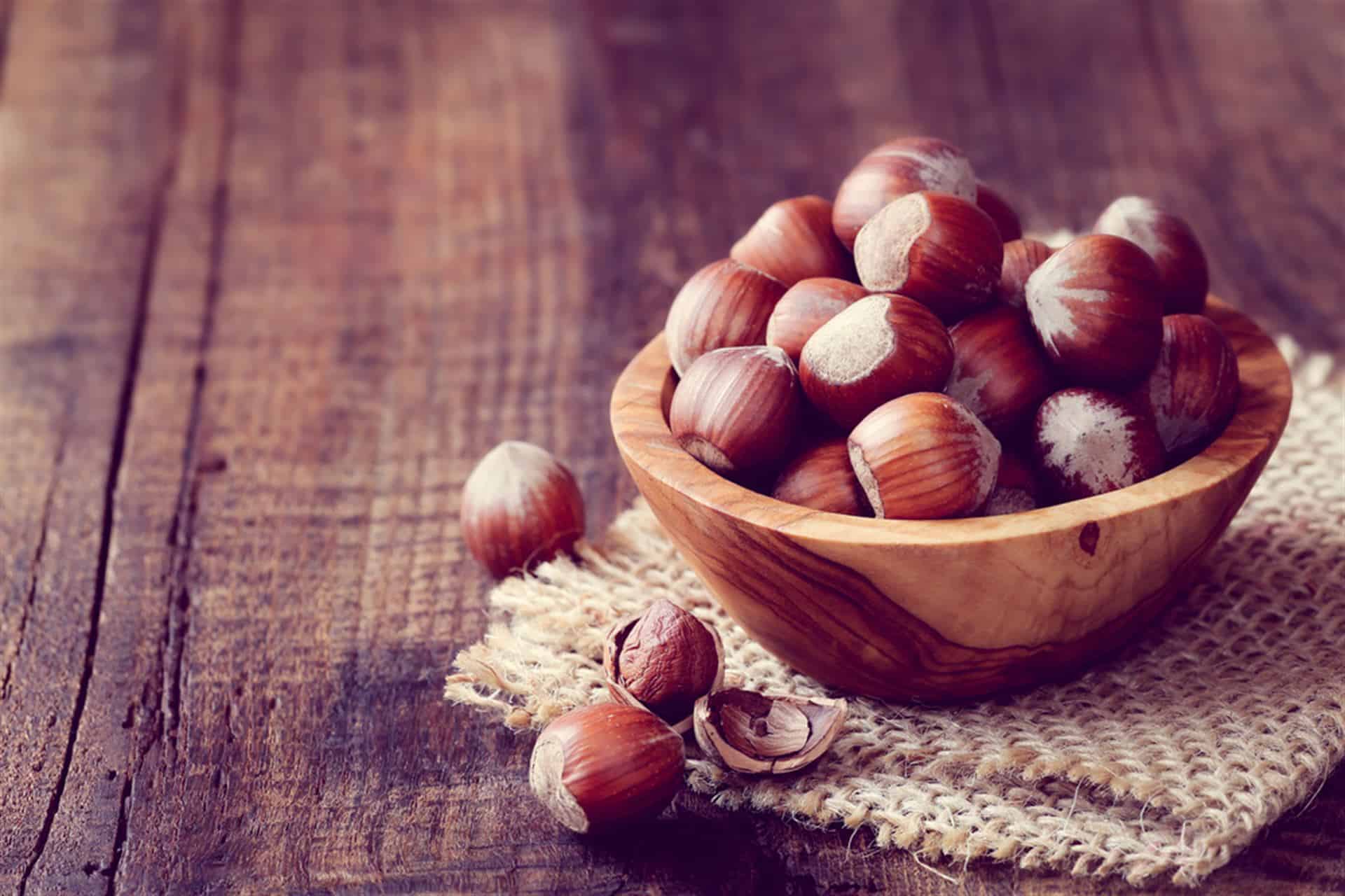 hazelnuts in wooden bowl
